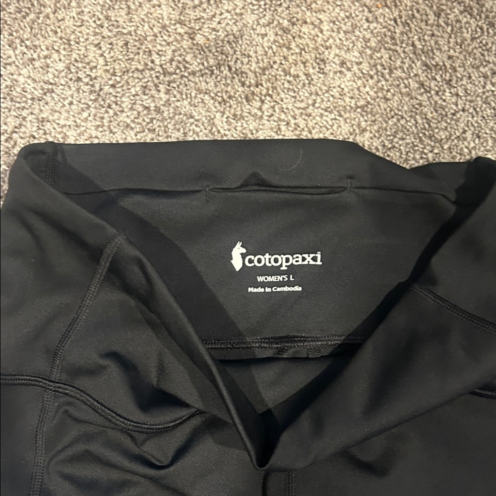 Cotopaxi Women's leggins.  Black with burgundy at ankle